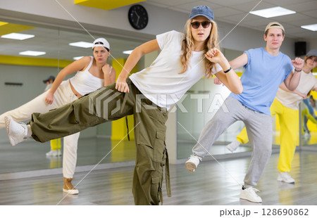 Teenage girl training breakdance Footwork moves in dance hall 128690862