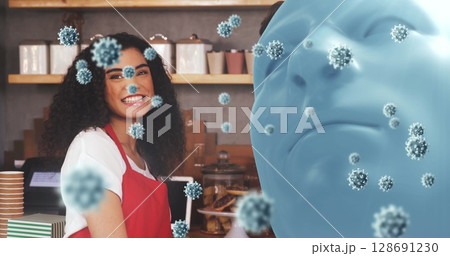 Smiling barista serving at café counter with display case and virus particles, copy space 128691230
