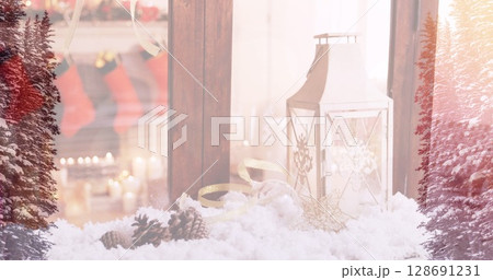 Image of candles over window with christmas decorations 128691231