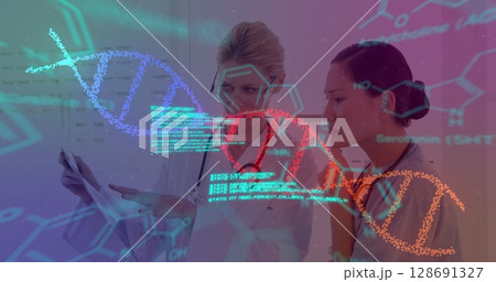 Image of data processing and dna strand spinning over diverse female doctors Image of data processing and dna strand spinning over diverse female doctors 128691327