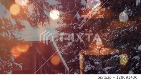 Image of candles over winter coniferous trees with snow 128691430