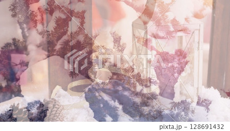 Image of candles over winter coniferous trees with snow 128691432