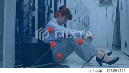 Image of hearts over caucasian businesswoman in server room Image of hearts over caucasian businesswoman in server room 128691533
