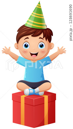 Happy little boy sitting on a gift box 128691690