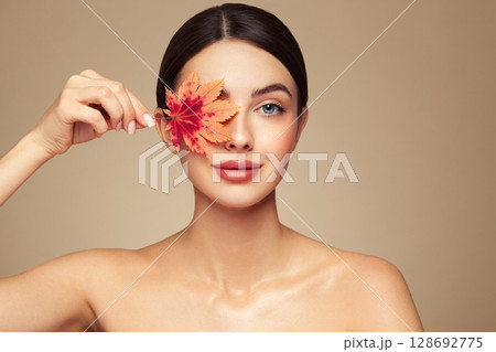 Autumn portrait of beautiful woman with clean fresh skin 128692775