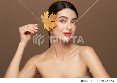 Autumn portrait of beautiful woman with clean fresh skin Autumn portrait of beautiful woman with clean fresh skin 128692778