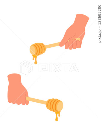 Honey dripping to a honey dipper isolated on a white background 128693200
