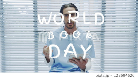 Image of world book day over caucasian male doctor using tablet 128694626
