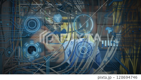 Image of processing circle over data and caucasian man checking computer wires 128694746