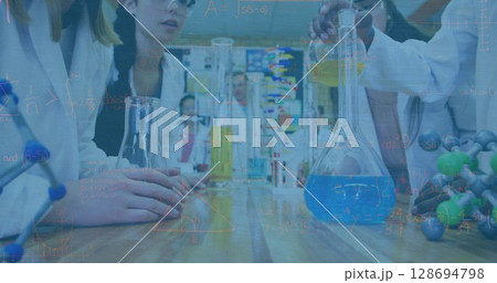 Image of mathematical equations over diverse schoolchildren with models in lab 128694798