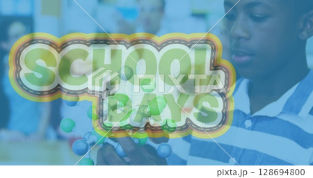 Image of school days text over african american boy with model in lab Image of school days text over african american boy with model in lab 128694800