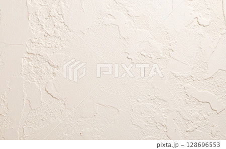 ベージュの壁の背景テクスチャ 128696553