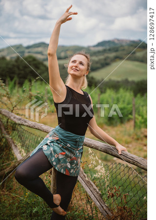 Woman Posing Gracefully Outdoors 128697417