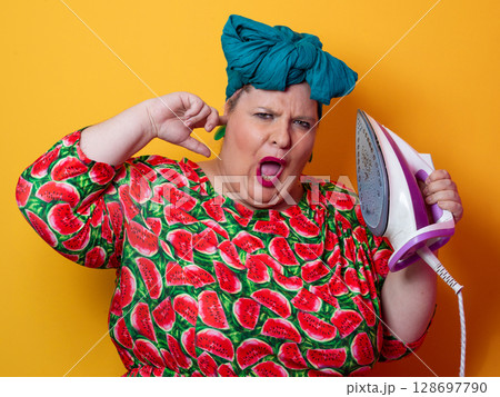 Colorful Woman Holding Iron and Shouting with Funny Expression 128697790