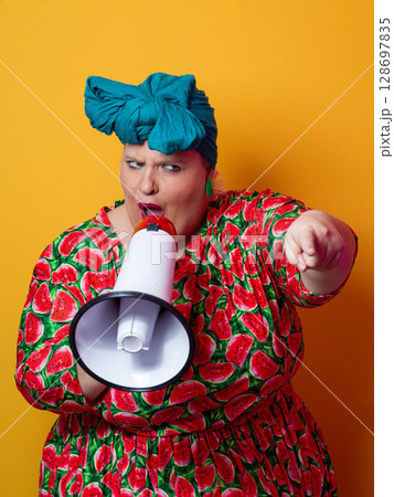 Colorful Retro Woman Shouting Through a Megaphone Colorful Retro Woman Shouting Through a Megaphone 128697835