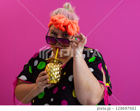 Stylish Woman with Pineapple Drink Against Pink Background 128697881