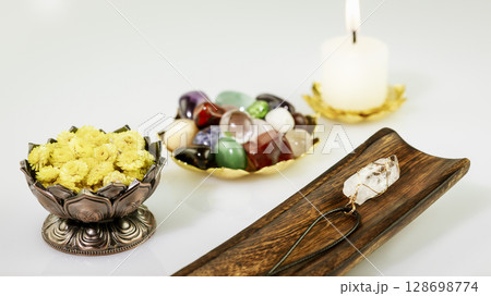 Relaxing ritual with crystals stones set, candle and dry flowers on white background. Esoteric spiritual practice, Healing Crystal Ritual, Relax Chakra. Recovering, relaxing at home, self care concept 128698774