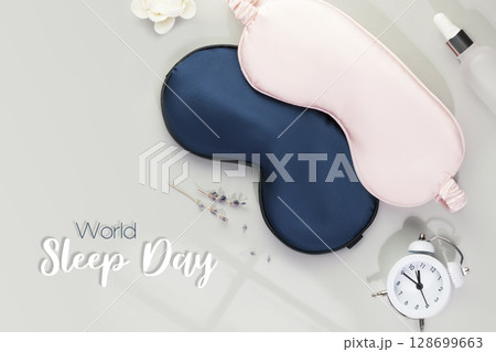 World sleep day card with masks for sleep, alarm clock with time for sleep and lavender flowers on a grey background with inscription World Sleep Day World sleep day card with masks for sleep, alarm clock with time for sleep and lavender flowers on a grey background with inscription World Sleep Day 128699663