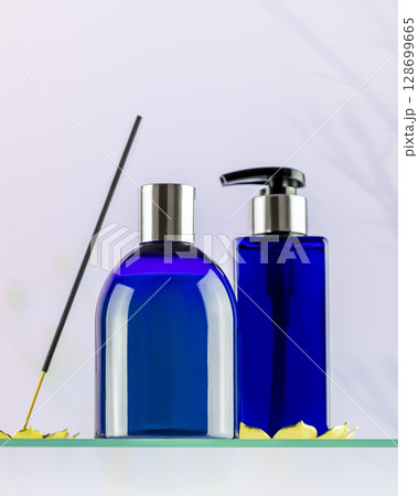 Mockup of natural spa beauty products for men. Blue cosmetic bottles on glass shelf on light gradient background with aroma stick and shadows 128699665