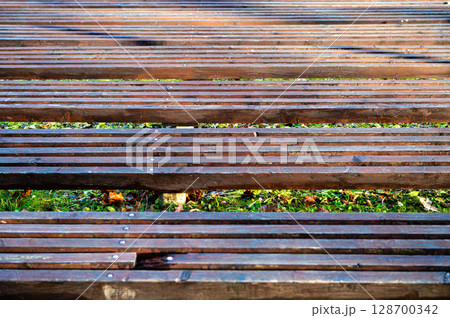 Spectator seats of the outdoor stage. Construction of wooden seats. 128700342