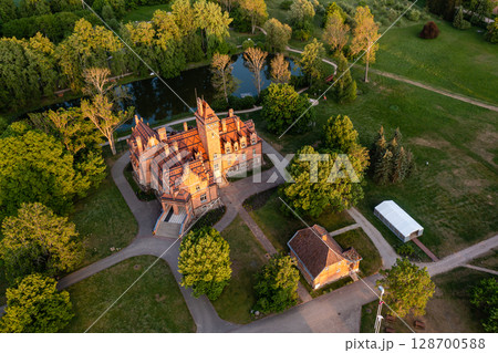 Jaunmoku brick medieval castle and its territory near Tukums, Latvia, drone view 128700588