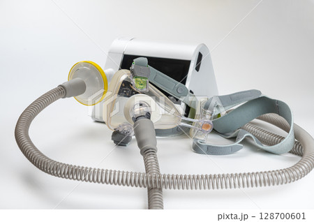 Continuous positive airway pressure system includes of CPAP machine, mask, tube on white background Continuous positive airway pressure system includes of CPAP machine, mask, tube on white background 128700601