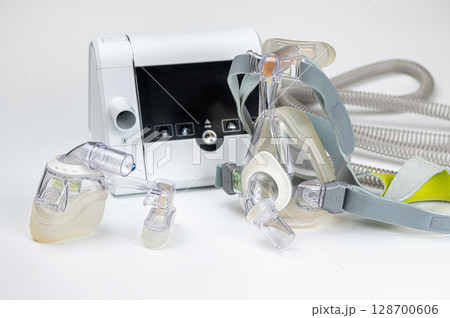 CPAP machine with mask and hose, for people with sleep apnea, respiratory, or breathing disorder CPAP machine with mask and hose, for people with sleep apnea, respiratory, or breathing disorder 128700606