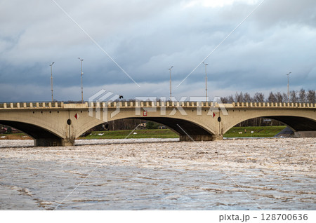 A huge load of ice in the Lielupe river near the road traffic bridge in Jelgava. A huge load of ice in the Lielupe river near the road traffic bridge in Jelgava. 128700636