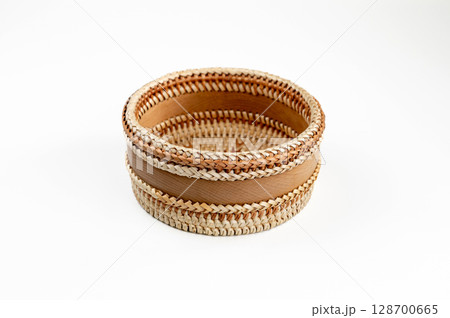 Wicker basket on a white background, isolate, close-up Wicker basket on a white background, isolate, close-up 128700665