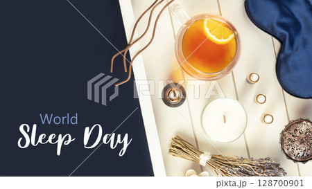 World Sleep Day holiday card with blue sleeping mask, lavender flower, herbal tea, and natural oils on a white wooden tray on deep blue background with inscription World Sleep Day World Sleep Day holiday card with blue sleeping mask, lavender flower, herbal tea, and natural oils on a white wooden tray on deep blue background with inscription World Sleep Day 128700901