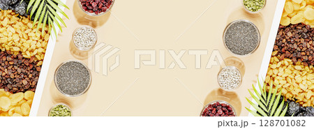 Organic dry fruits, nuts and seeds assortment on beige background with copy space. Healthy snack, mix of organic nuts and dry fruits. Vegan and vegetarian products. Healthy food. Flat lay, banner size Organic dry fruits, nuts and seeds assortment on beige background with copy space. Healthy snack, mix of organic nuts and dry fruits. Vegan and vegetarian products. Healthy food. Flat lay, banner size 128701082