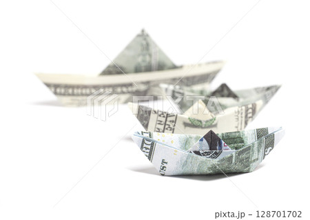 Money Origami boat with one hundred Dollar bills Money Origami boat with one hundred Dollar bills 128701702