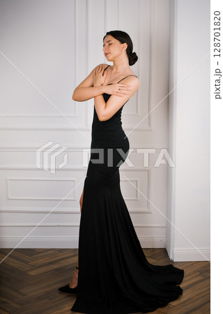 Serene Portrait Of Woman In Black 128701820