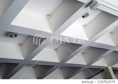 concrete structure ceiling, concrete with light and smoke detectors, architecture details concrete structure ceiling, concrete with light and smoke detectors, architecture details 128702474