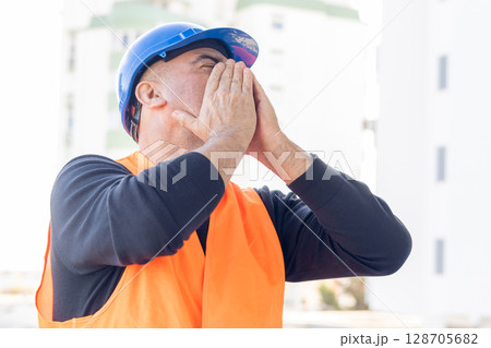 Building contractor receiving bad news Building contractor receiving bad news 128705682