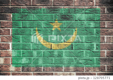 Mauritania flag on old brick wall background Mauritania flag on old brick wall background 128705771