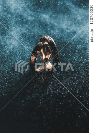 Gold wedding rings for newlyweds. Precious wedding rings for a couple for a wedding Gold wedding rings for newlyweds. Precious wedding rings for a couple for a wedding 128706030
