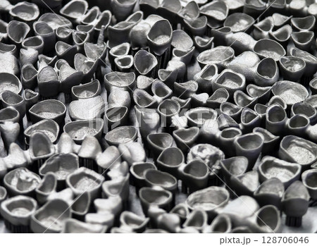 Innovative 3D printing process creates intricate metallic structures in a workshop environment Innovative 3D printing process creates intricate metallic structures in a workshop environment 128706046
