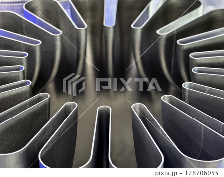 Detailed close-up view of a 3D printed component showcasing intricate designs and exact features during the manufacturing process 128706055
