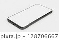 Gray smartphone with blank white screen, angled view, on a plain white surface. 128706667