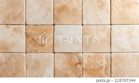 Weathered Travertine tiles with varied natural textures and yellowish tones in square layout Weathered Travertine tiles with varied natural textures and yellowish tones in square layout 128707344