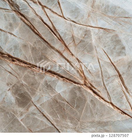 Neutral Truffle marble with soft beige and taupe tones and sharp brown veining in macro texture 128707507