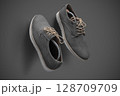 Stylish Gray Suede Casual Shoes with Beige Laces on Gray Background 128709709