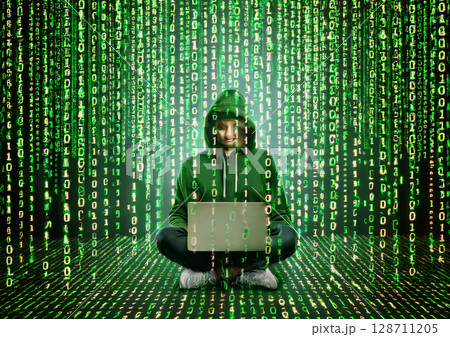 マトリックスのようなデジタルコードの雨の中フードをかぶったハッカーの様な人物がノートパソコンを操作 マトリックスのようなデジタルコードの雨の中フードをかぶったハッカーの様な人物がノートパソコンを操作 128711205