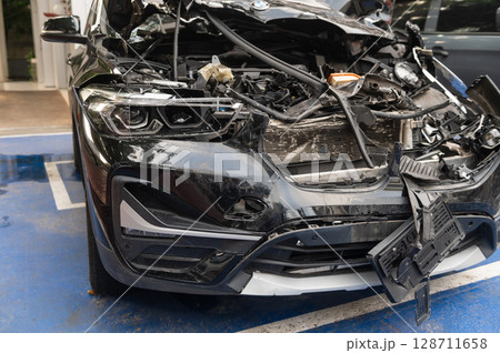 Front view of a broken car after an accident 128711658