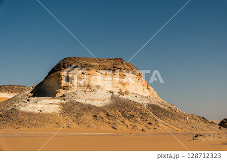 White rock formations and sand dunes in Egypt's White Desert, natural desert landscape	 128712323