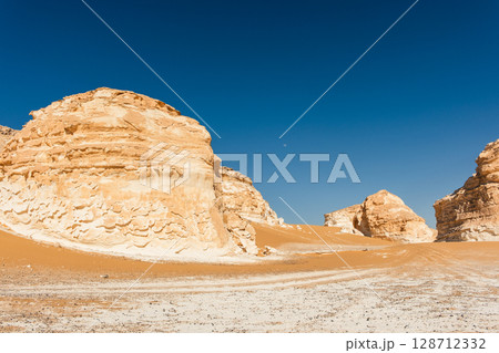 White rock formations and sand dunes in Egypt's White Desert, natural desert landscape	 128712332