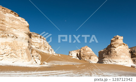 White rock formations and sand dunes in Egypt's White Desert, natural desert landscape White rock formations and sand dunes in Egypt's White Desert, natural desert landscape 128712342