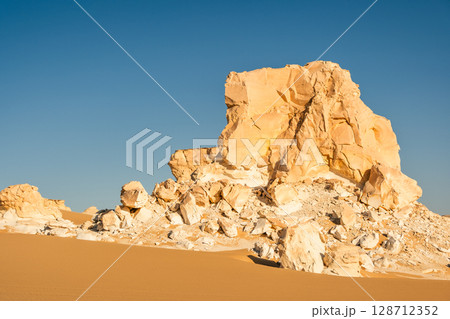 White rock formations and sand dunes in Egypt's White Desert, natural desert landscape	 128712352
