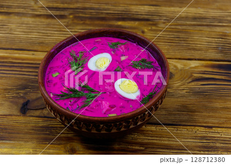 Cold beetroot soup on a wooden table Cold beetroot soup on a wooden table 128712380